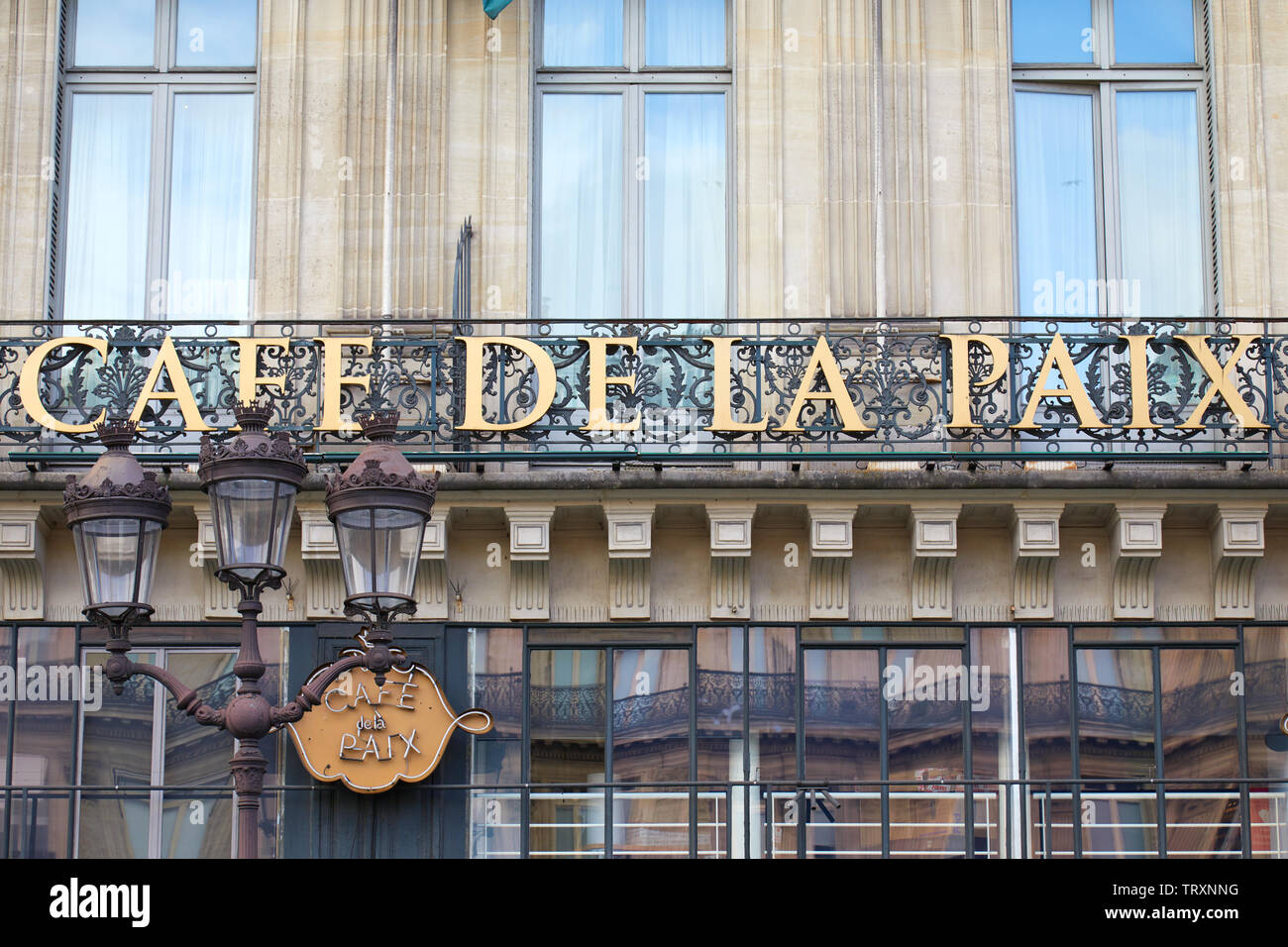 PARIS, FRANCE - JULY 22, 2017: Famous Cafe de la Paix sign in golden letters in Paris, France Stock Photo