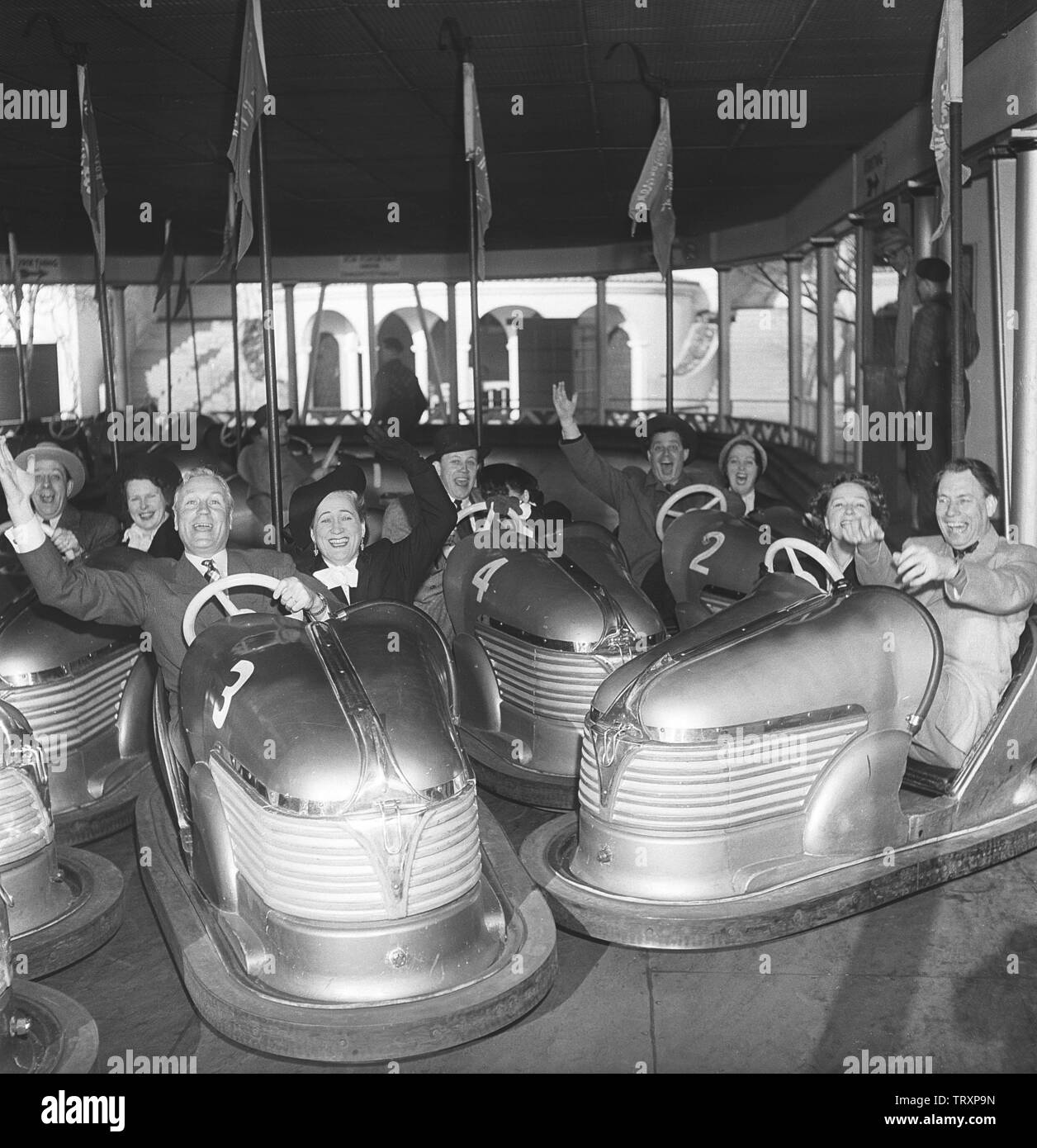 Amusement park in the 1950s. No matter old or young, bumper cars are one of the favorite attractions. Pictured a group of elderly people driving and having fun. Sweden 1950. Kristoffersson ref AY57-4 Stock Photo