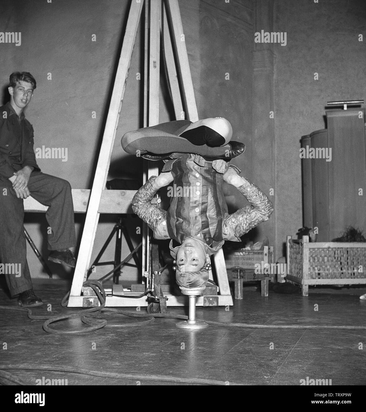 Balanced in the 1940s. A Young acrobatic man is standing on only his head and balancing his body in perfection with no help to stay that way by any means. Sweden 1946 Kristoffersson ref U66-3 Stock Photo