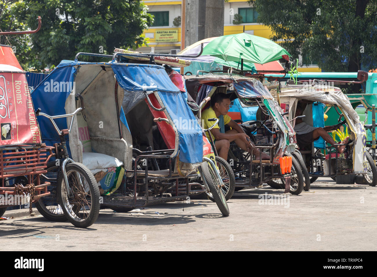 Manila, Philippines - September, 6, 2016: Philippine tricycles on the street Stock Photo