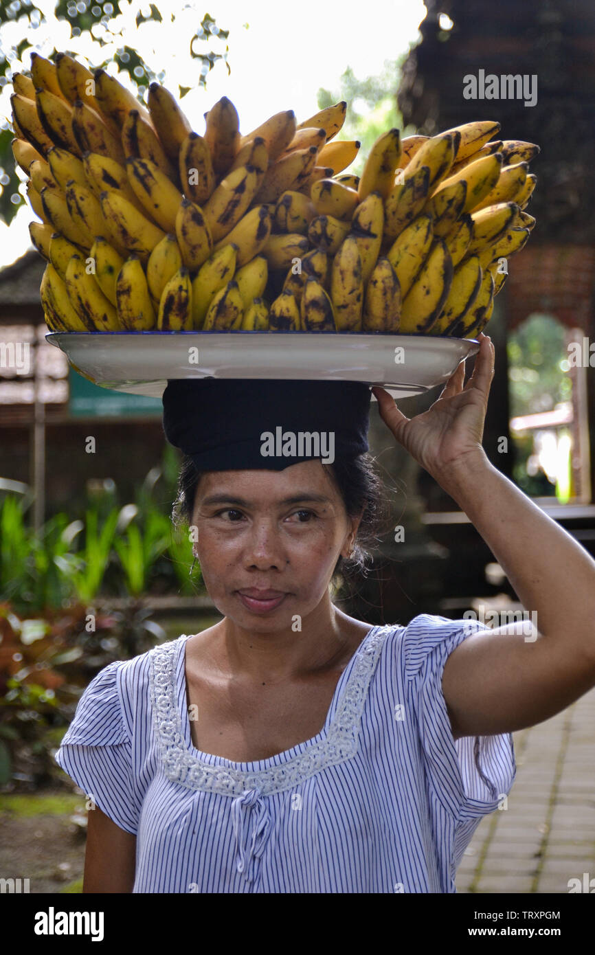 Balinese woman selling bananas Stock Photo
