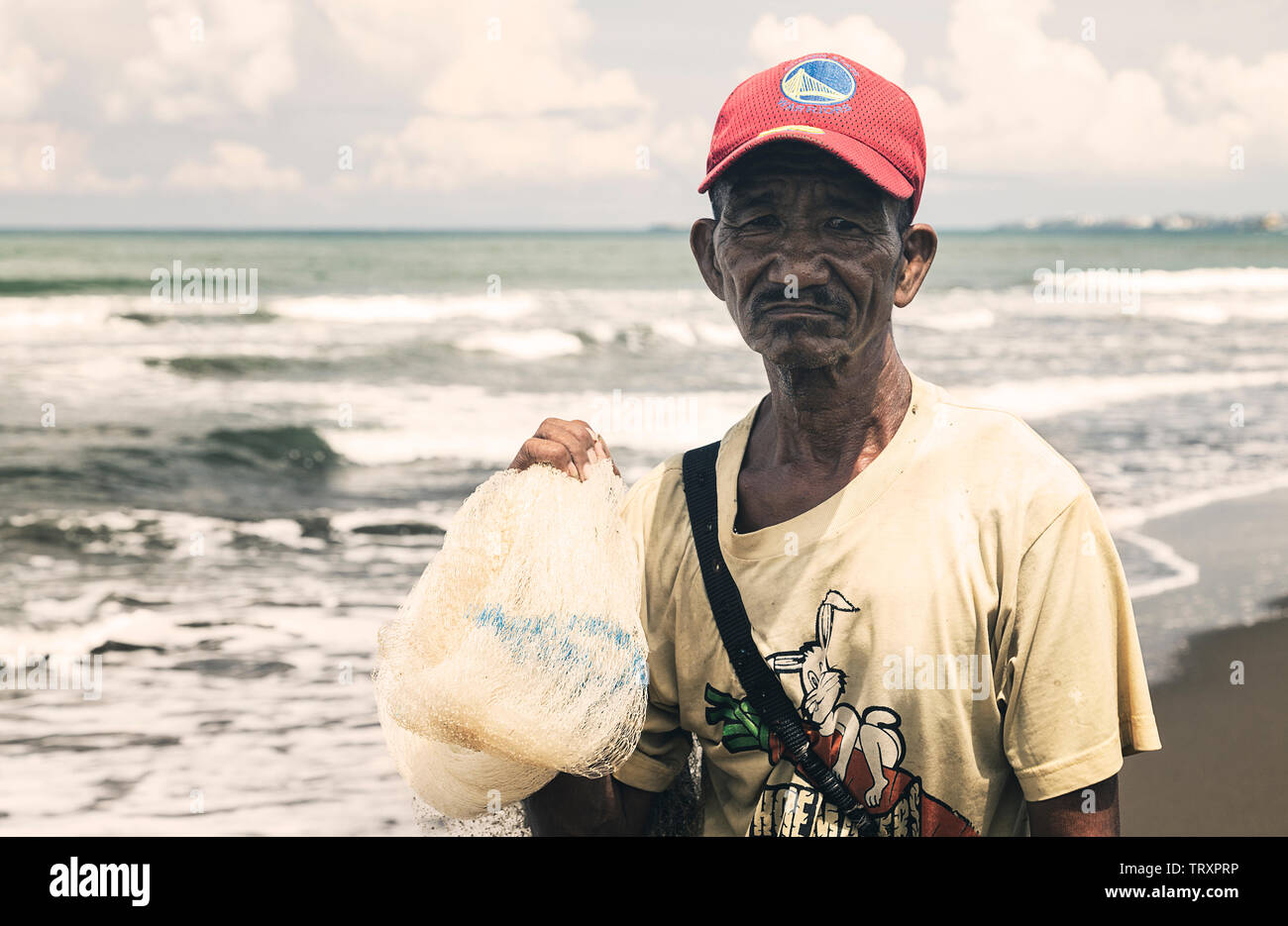 Manila, Philippines - September, 7, 2016: Portrait of a Filipino fisherman at the seaside Stock Photo