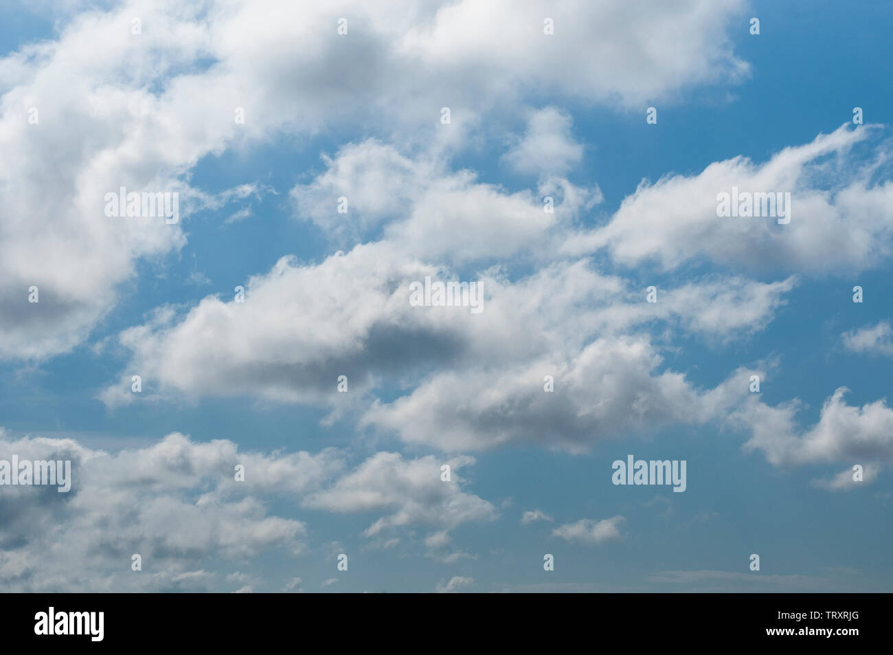 fluffy clouds on a sunny day Stock Photo - Alamy