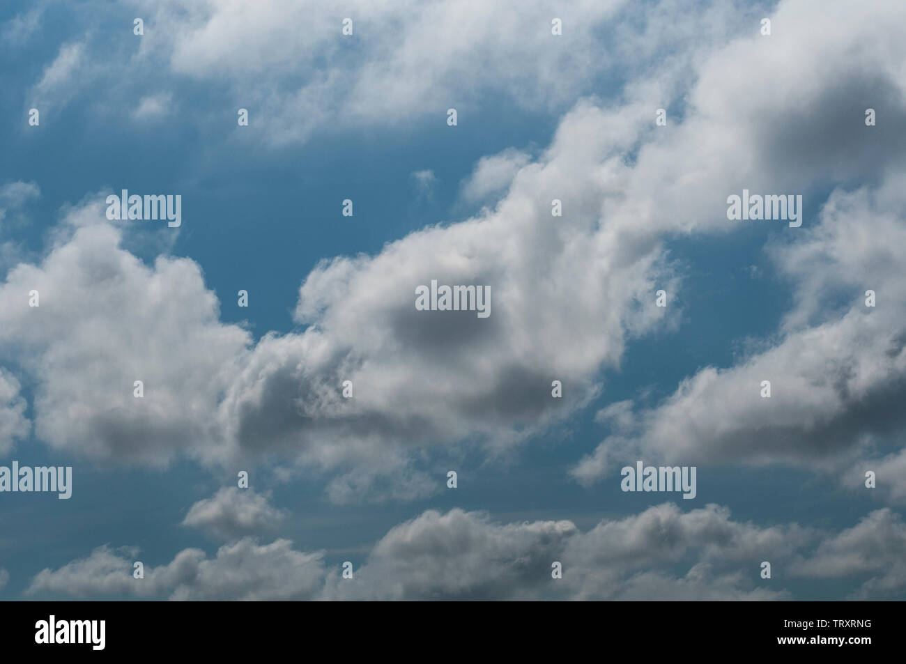 fluffy clouds on a sunny day Stock Photo - Alamy