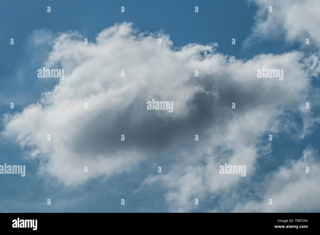 fluffy clouds on a sunny day Stock Photo - Alamy