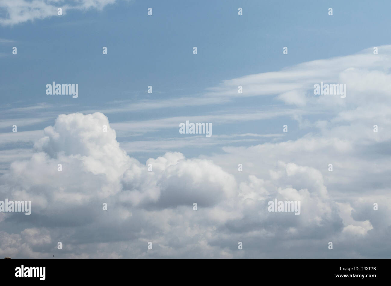 fluffy clouds on a sunny day Stock Photo - Alamy