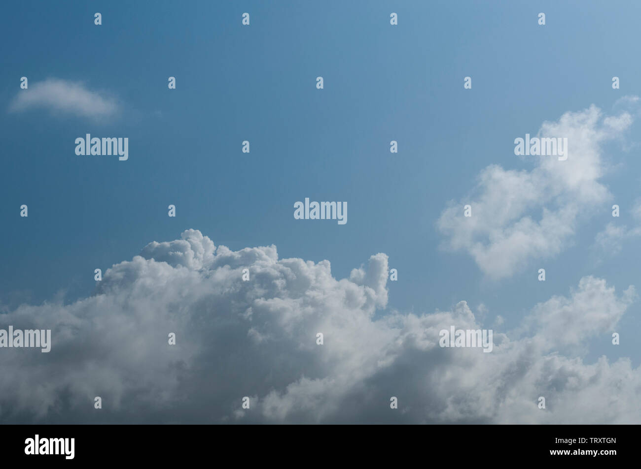 fluffy clouds on a sunny day Stock Photo - Alamy