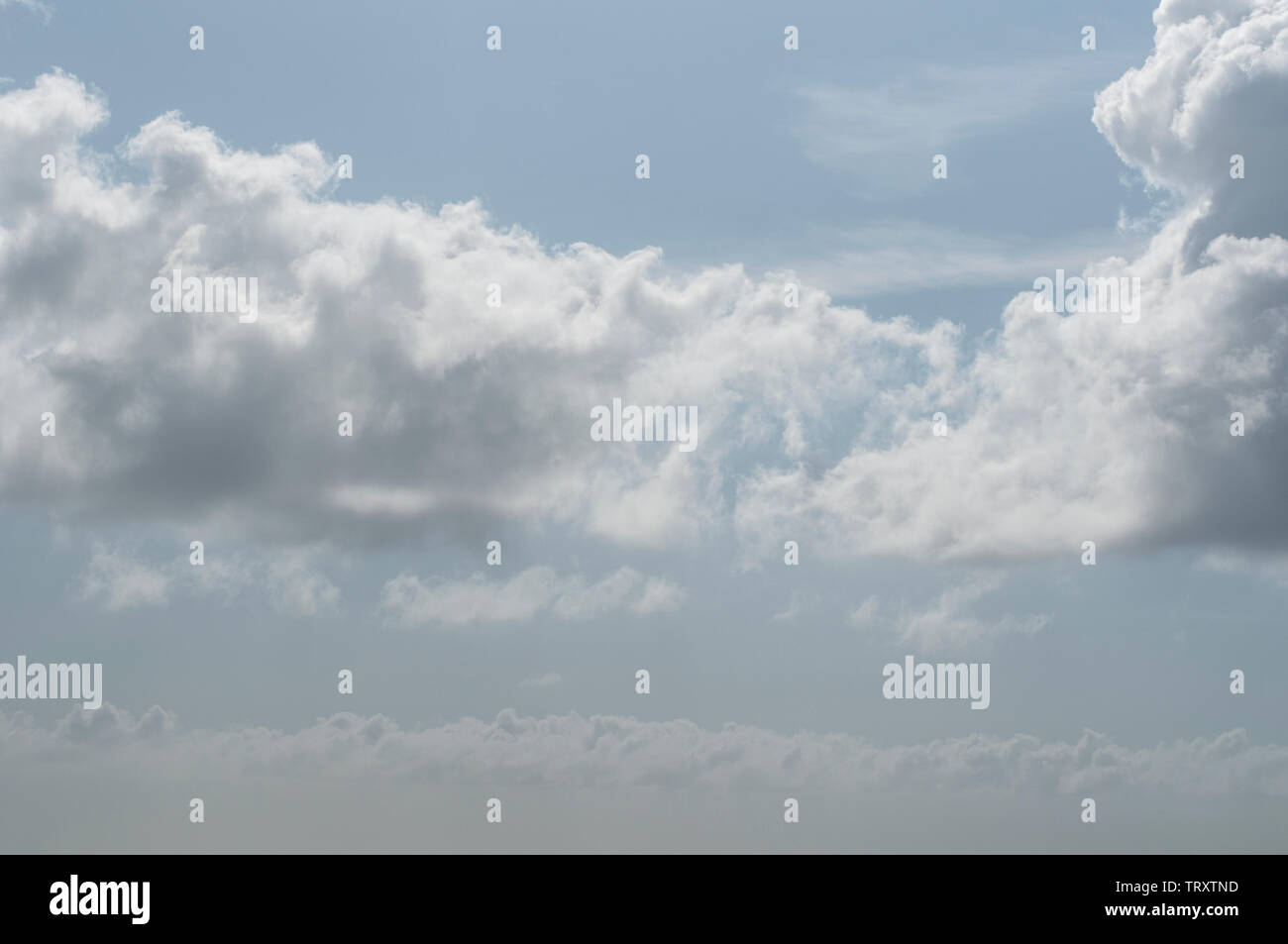 fluffy clouds on a sunny day Stock Photo - Alamy