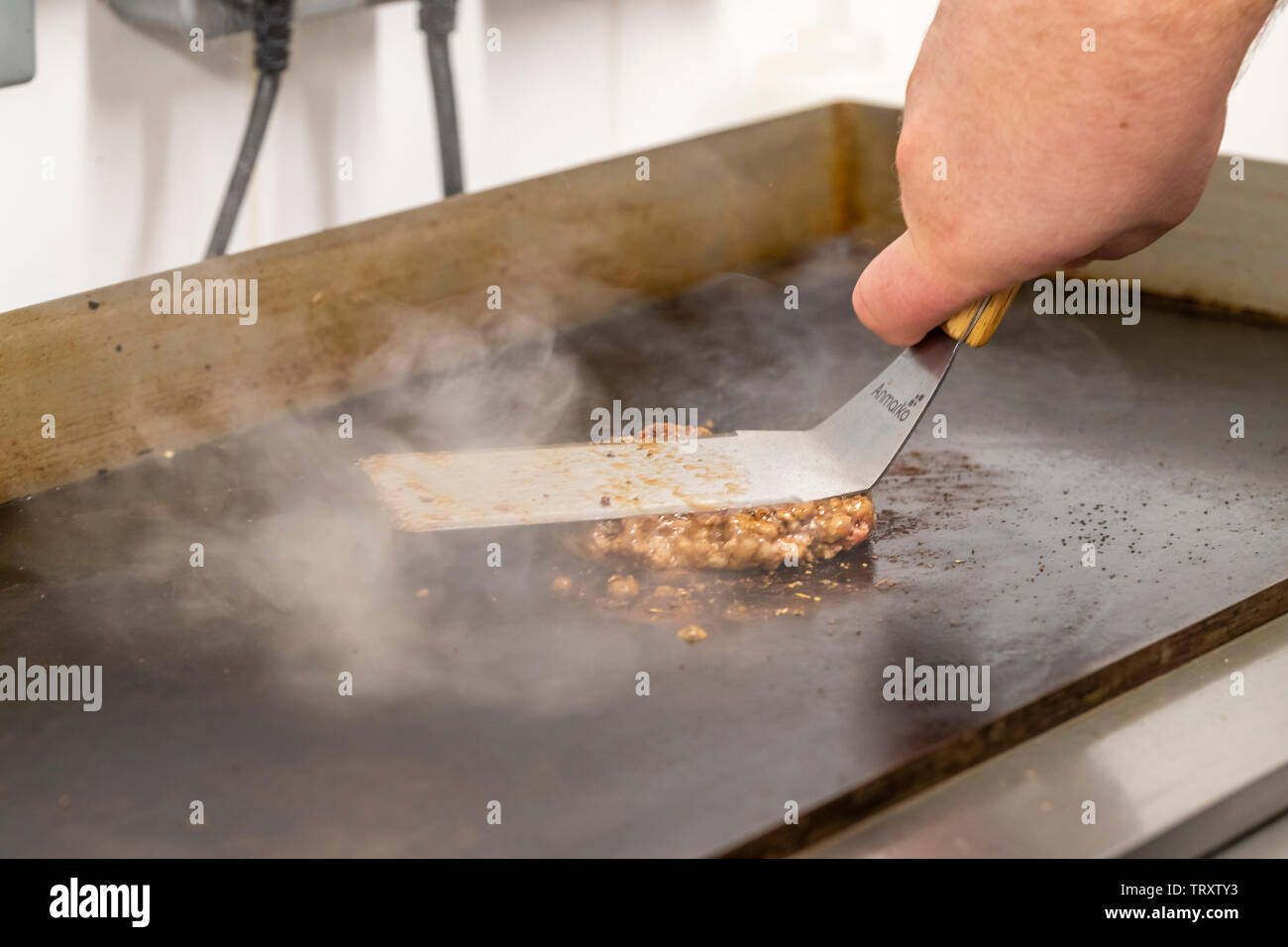 Putting together the Pig & Apple Burger at The Pig & Apple cafe. The cafe is based at Humble by Nature, Monmouthshire, Wales. Stock Photo