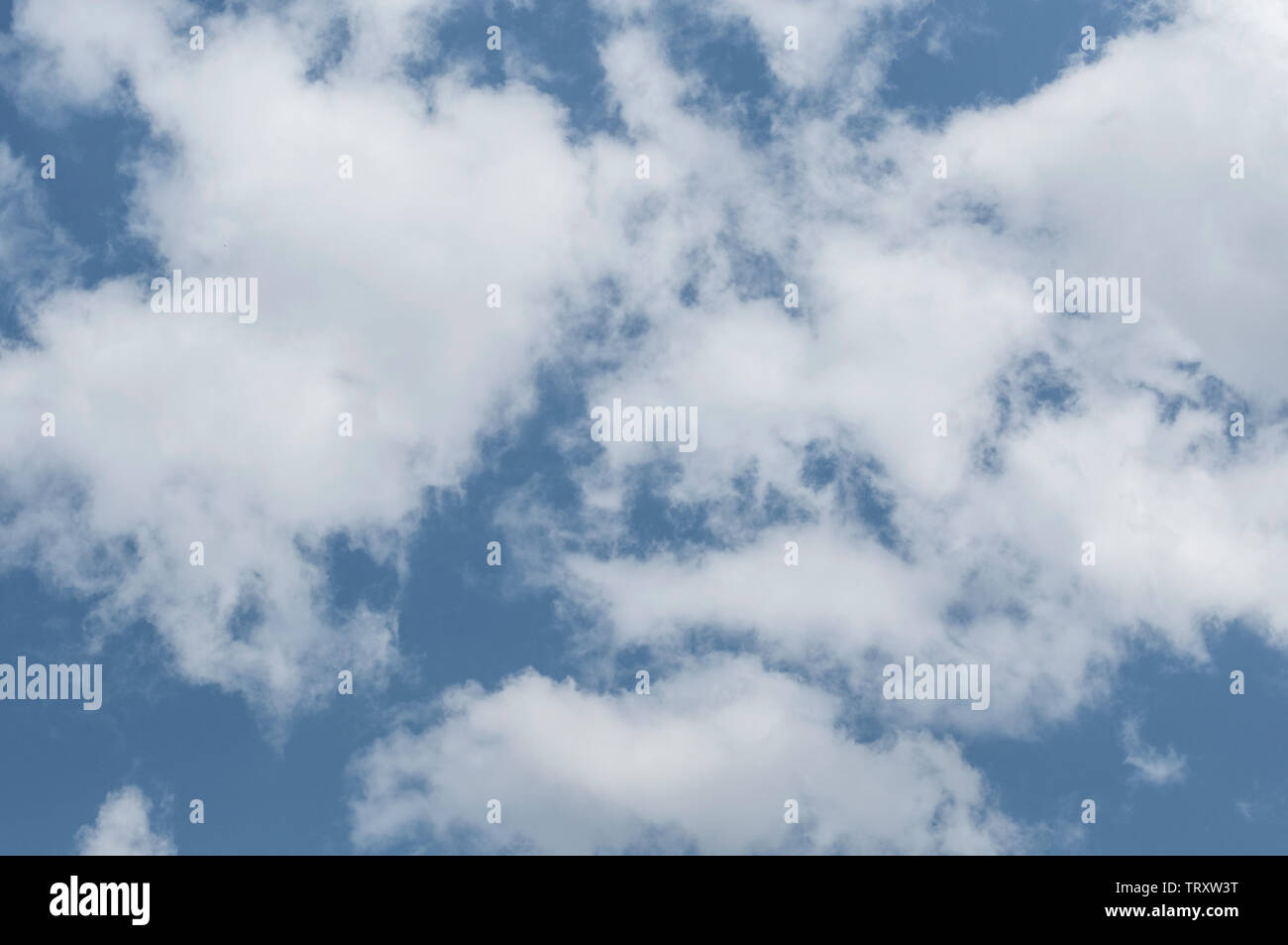fluffy clouds on a sunny day Stock Photo - Alamy