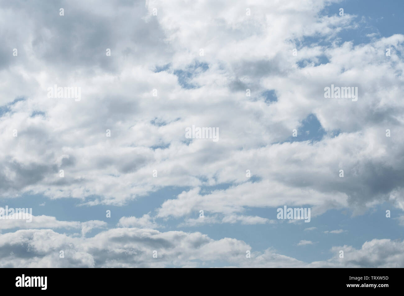 fluffy clouds on a sunny day Stock Photo - Alamy