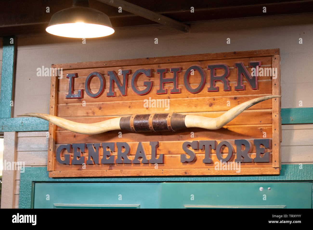 A longhorn sign above a general store in the historic Fort Worth Stockyards district Stock Photo