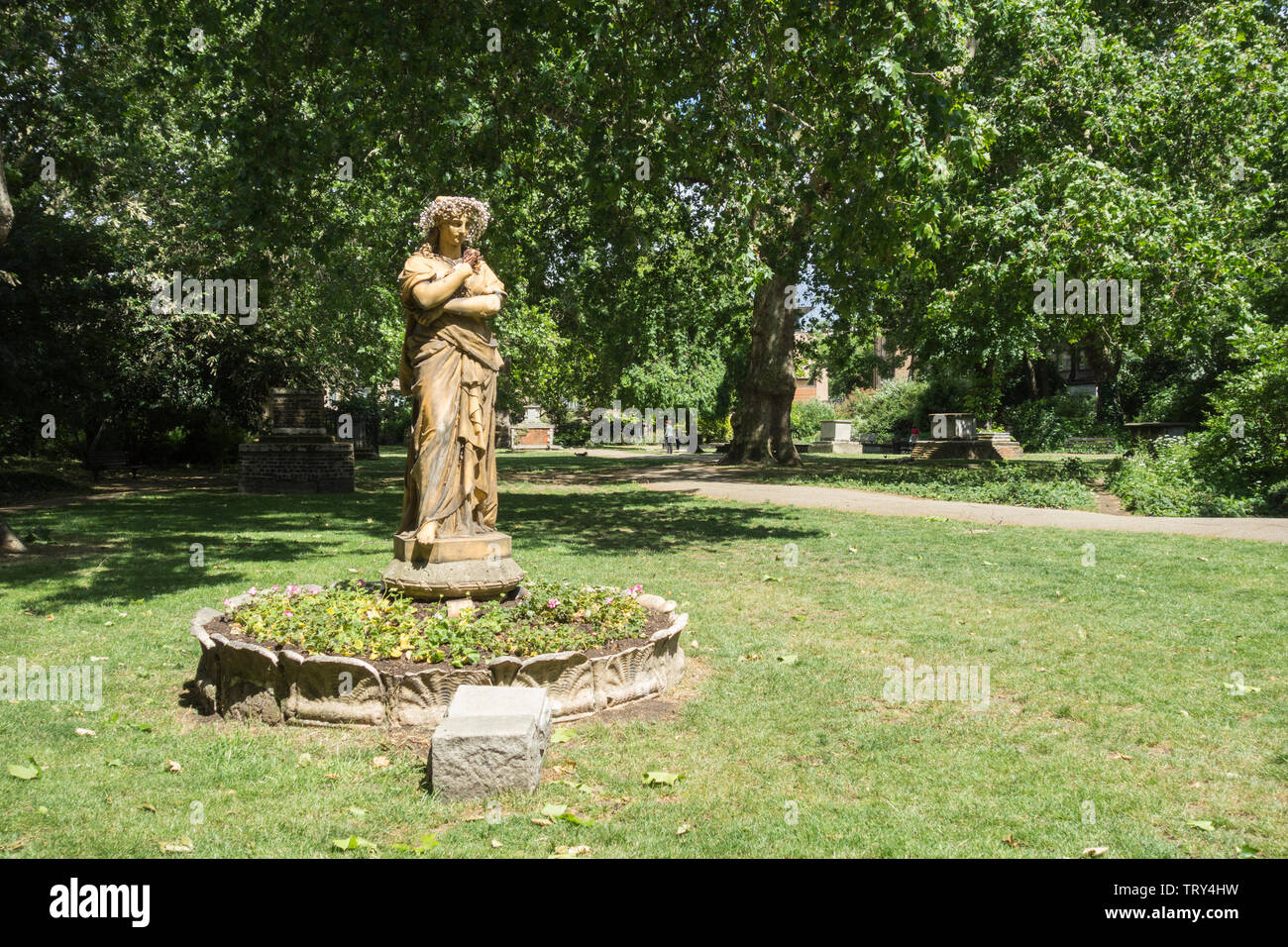 Terracotta statue of Euterpe the Muse of instrumental music, in St George's Garden's, Camden, London, UK Stock Photo
