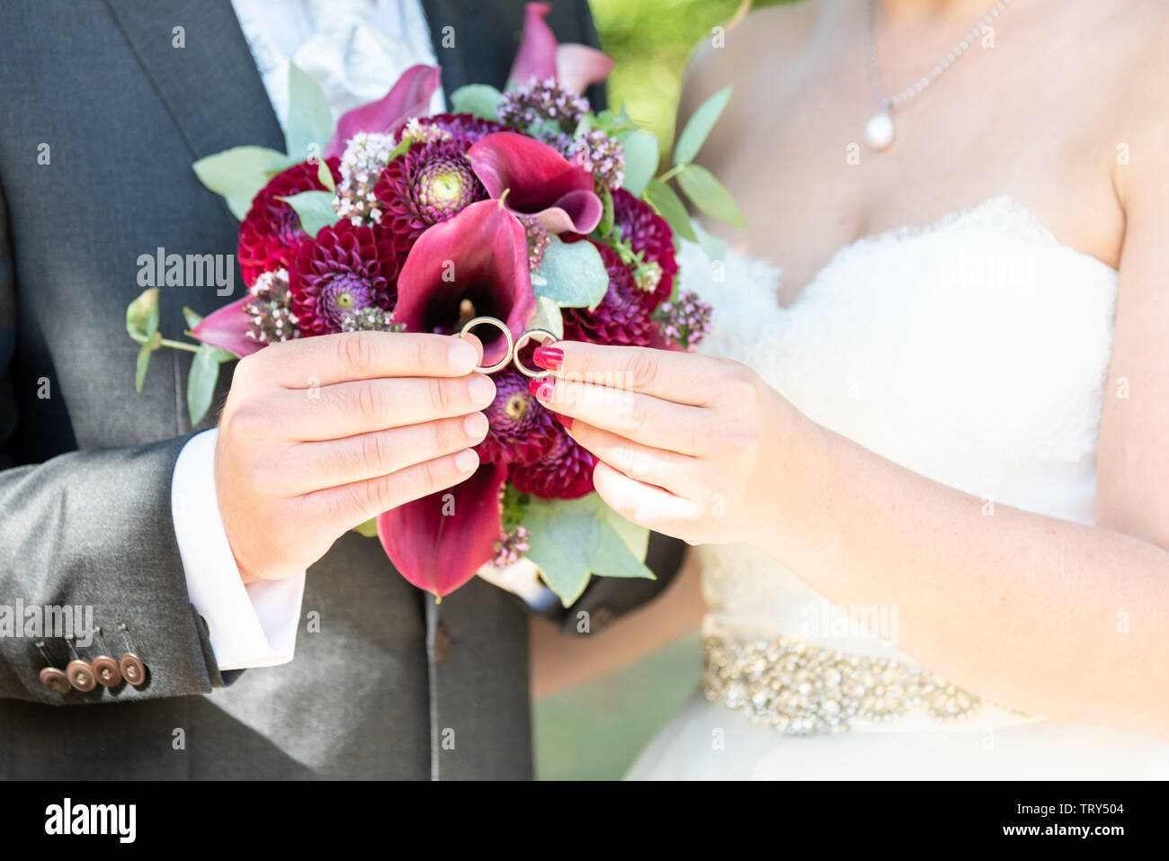 wedding couple hold rings in hand Stock Photo