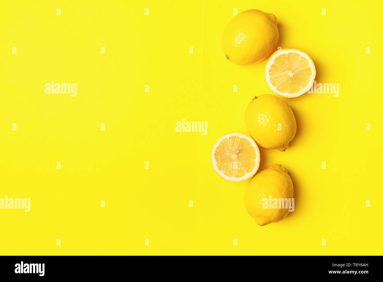 Horizontal Lemon Fresh juicy lemon on a bright yellow background. Concept minimalism ...