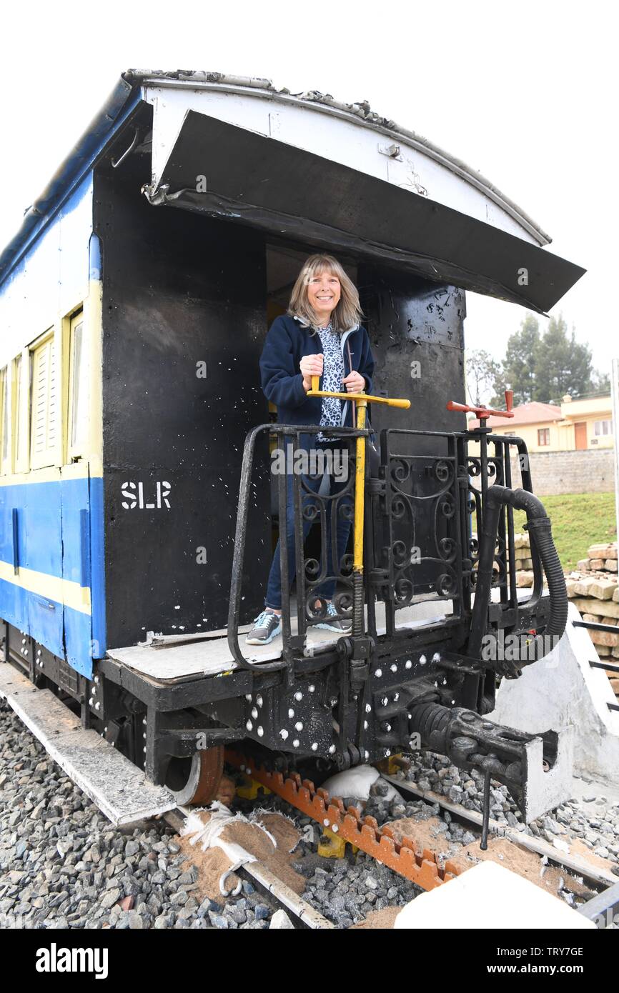 European lady on a train carriage (static display) at Oozy station