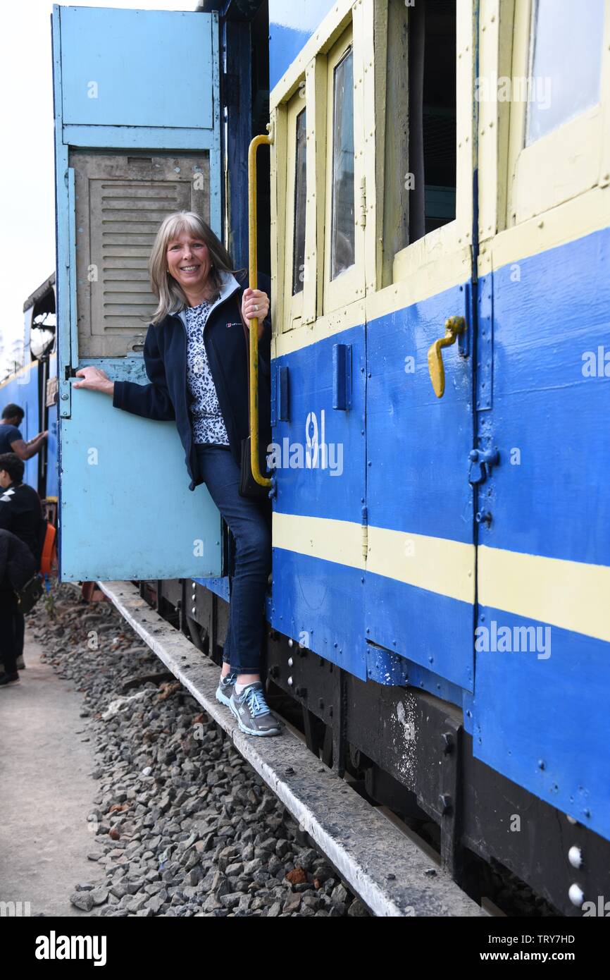 European lady on a train carriage (static display) at Oozy station