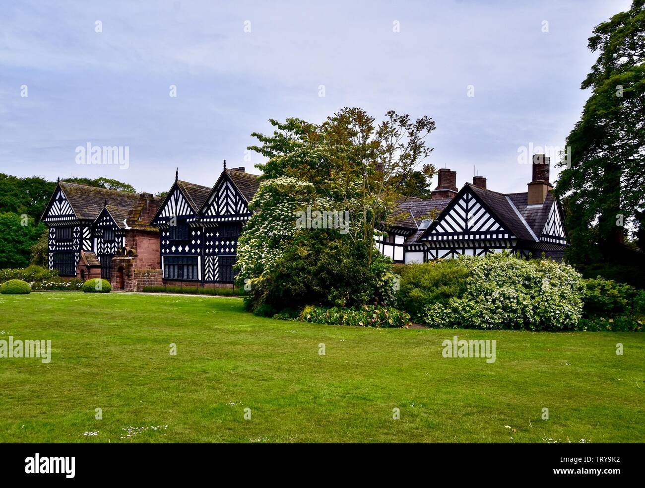 Speke Hall south and east aspects, along with the gardens. Stock Photo