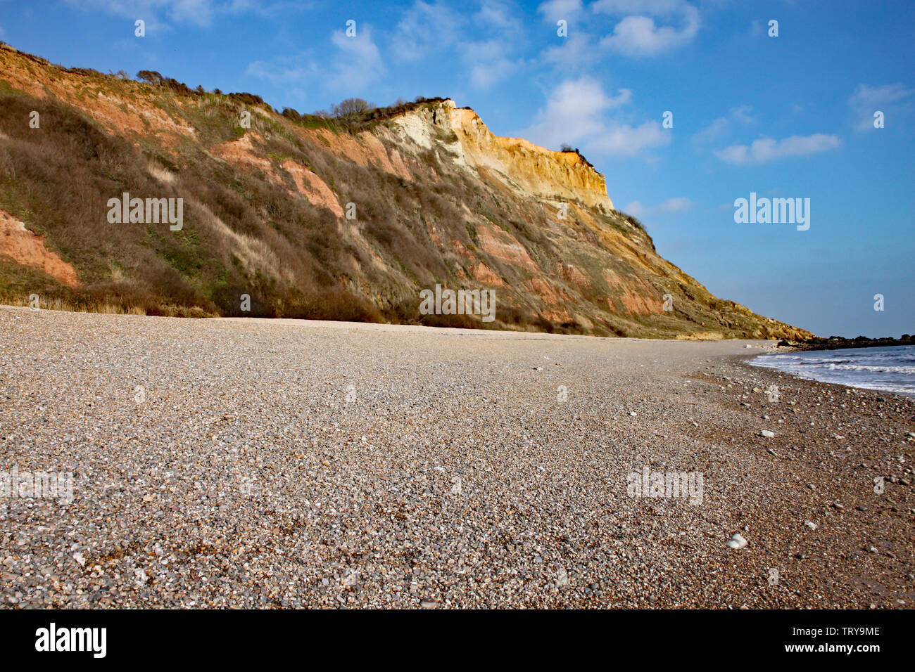 The sandstone cliffs of the Jurassic era rising from Salcombe Regis ...