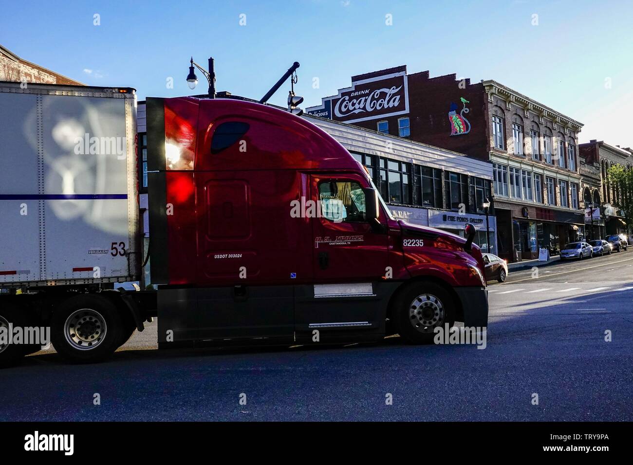 Torrington, Connecticut, USA A red truck driving on Main Streetin the
