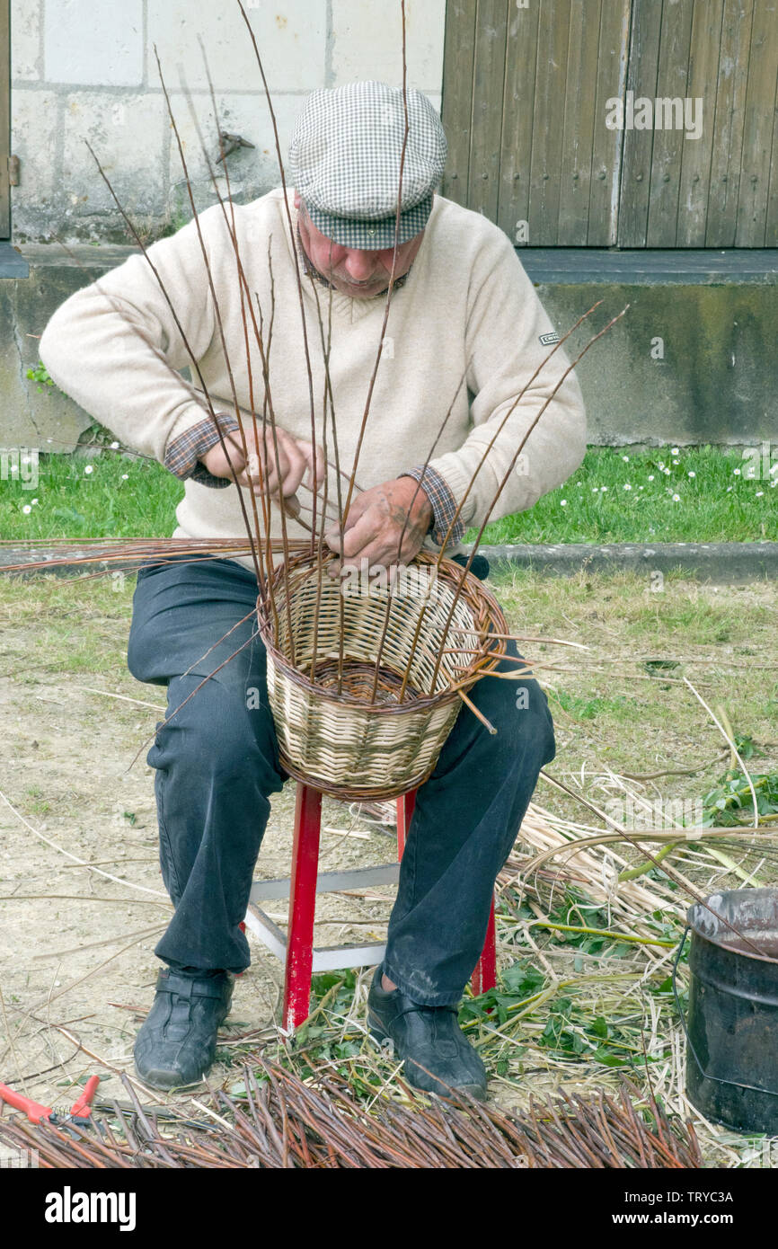 Basket Weaver at a French fair Stock Photo Alamy