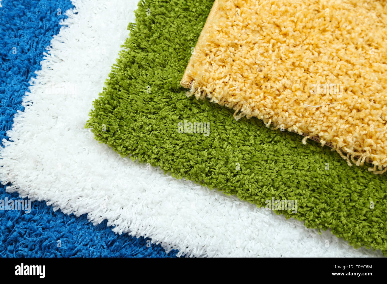 Many carpets of different colors close-up Stock Photo - Alamy