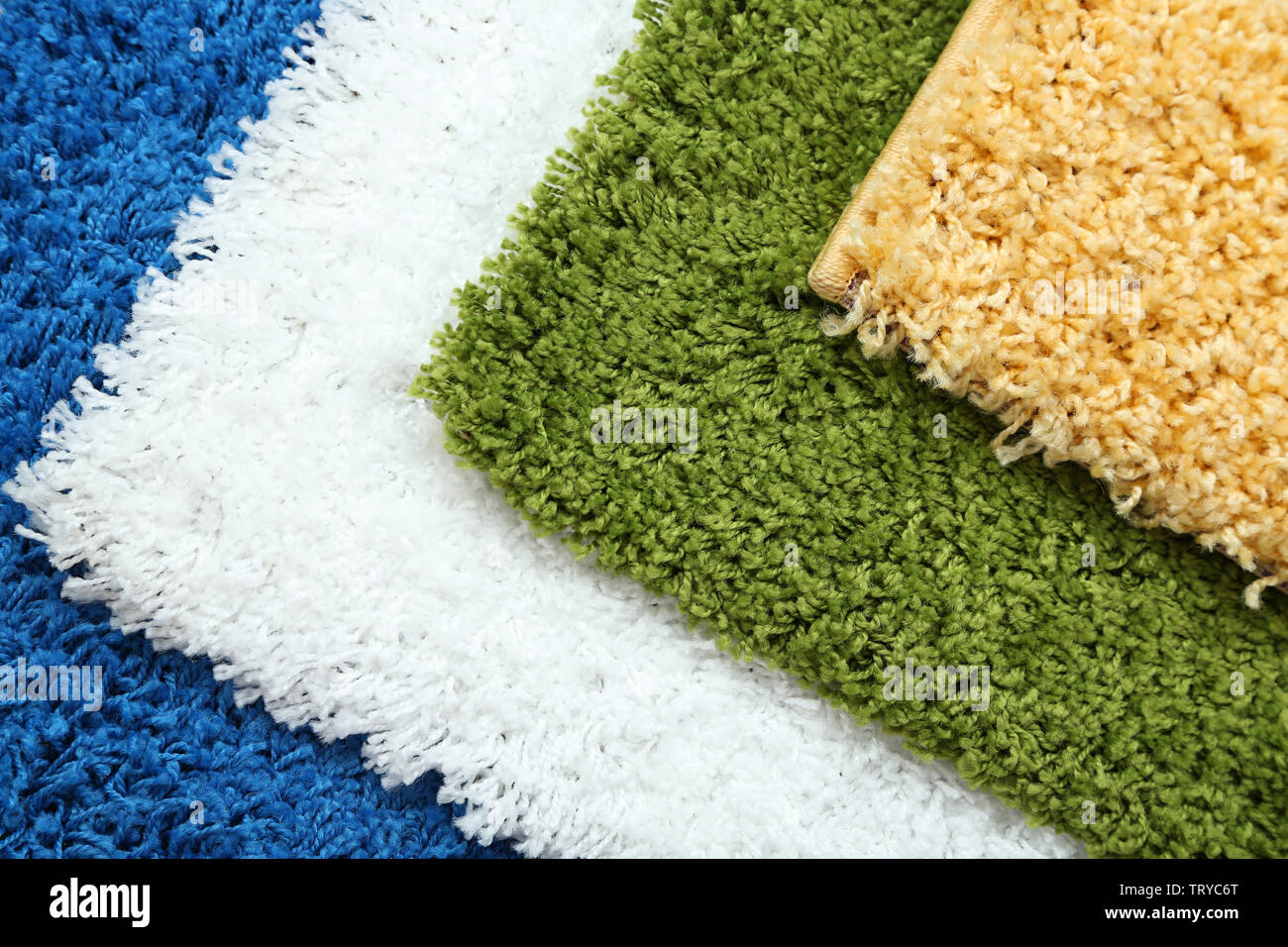 Many carpets of different colors close-up Stock Photo - Alamy