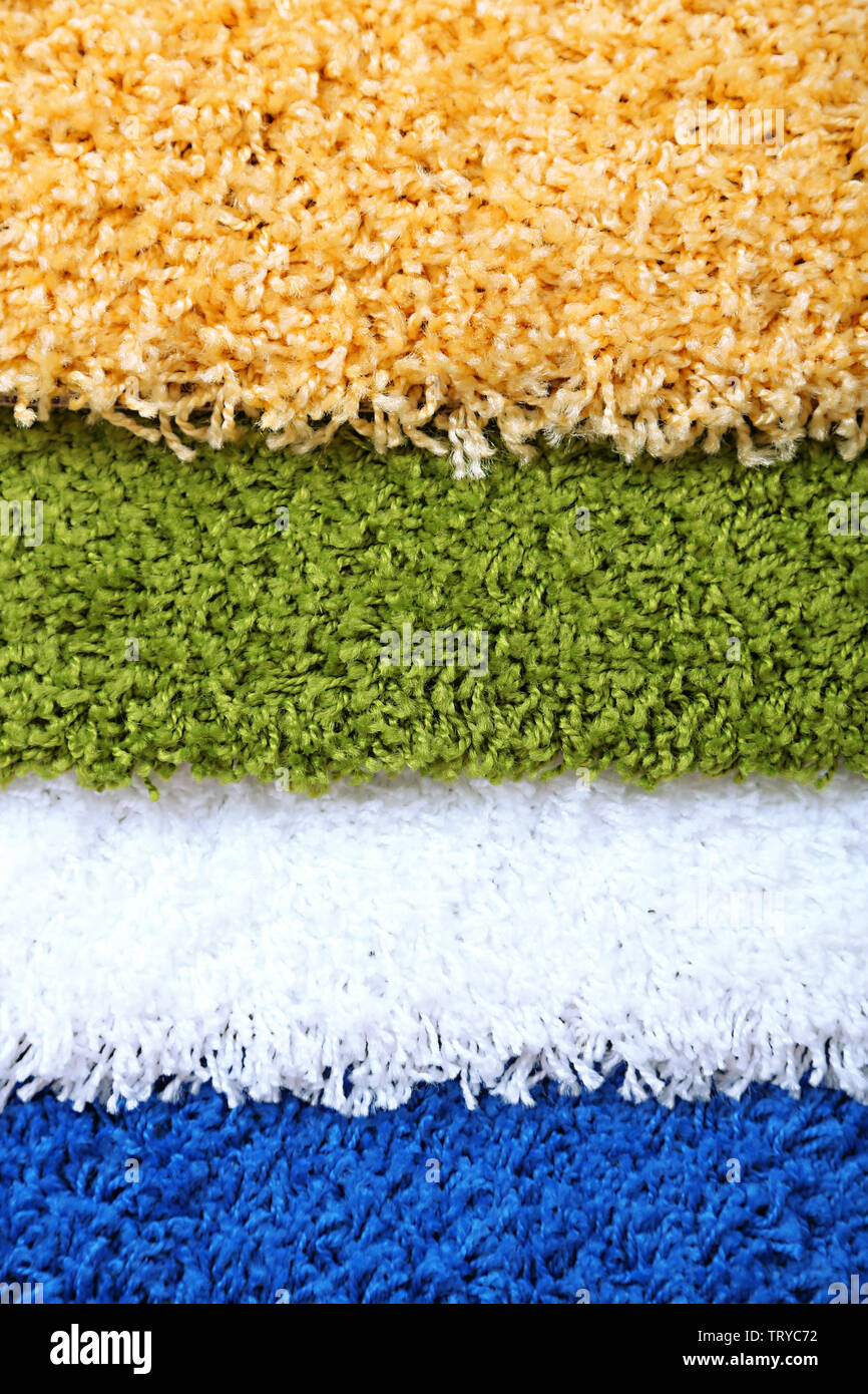 Many carpets of different colors close-up Stock Photo - Alamy
