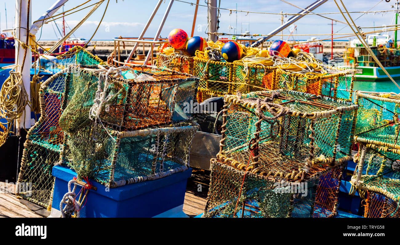 Crayfish nets and traps on a small fishing boat in Kalk Bay Harbour ...