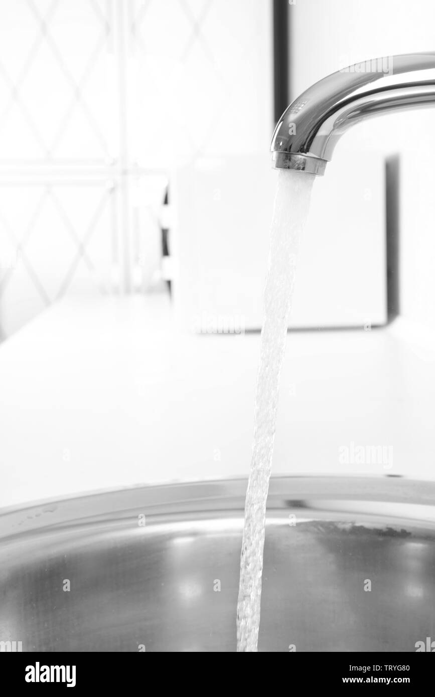 Water tap and sink in modern kitchen Stock Photo - Alamy