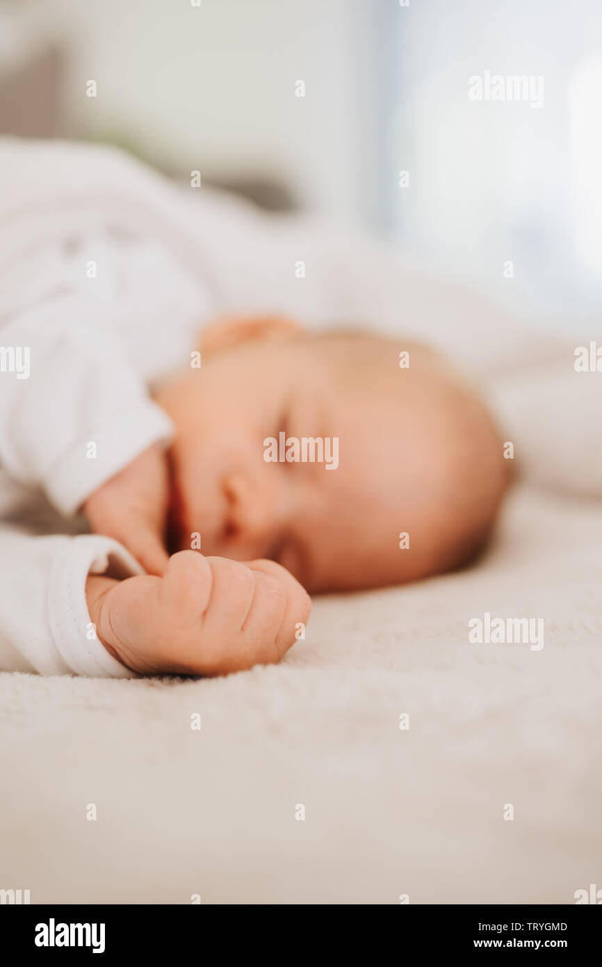 tiny hand of a sleeping baby Stock Photo