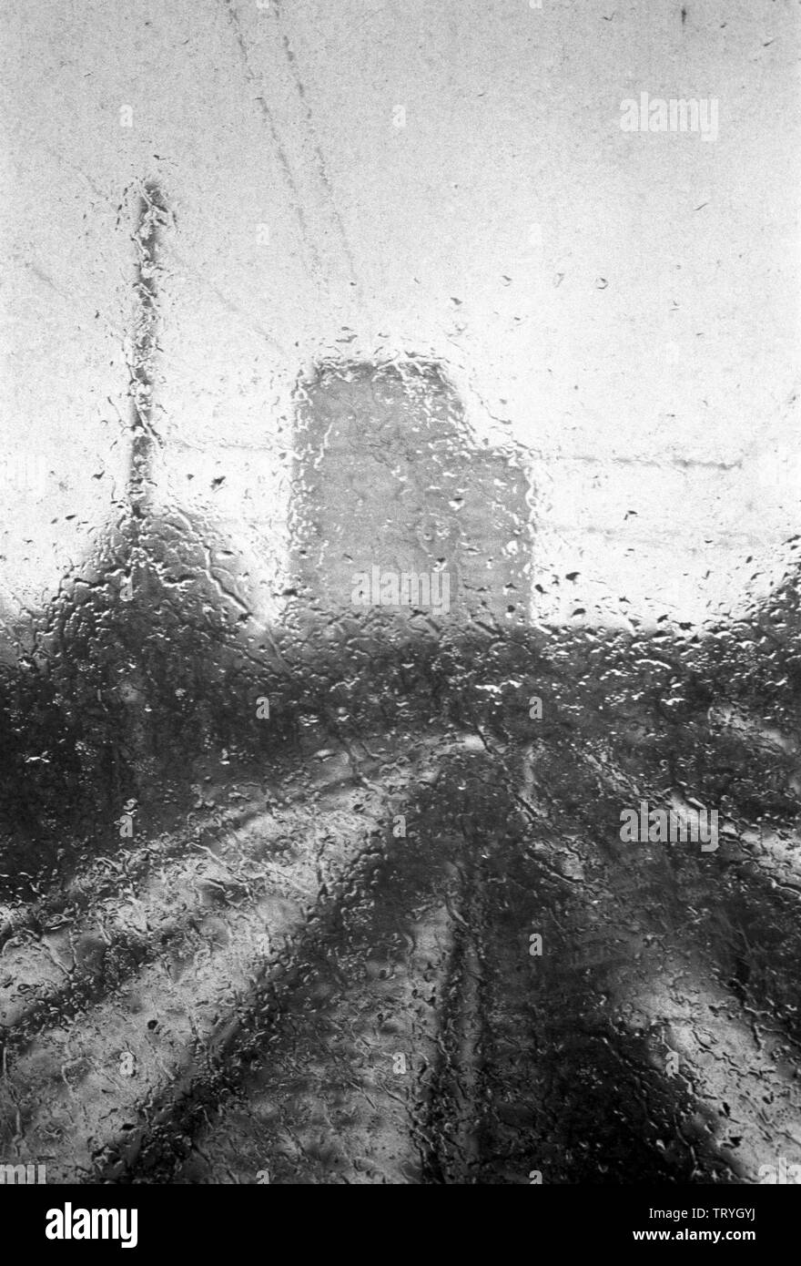 Black and white picture of a rainy day in a city Stock Photo