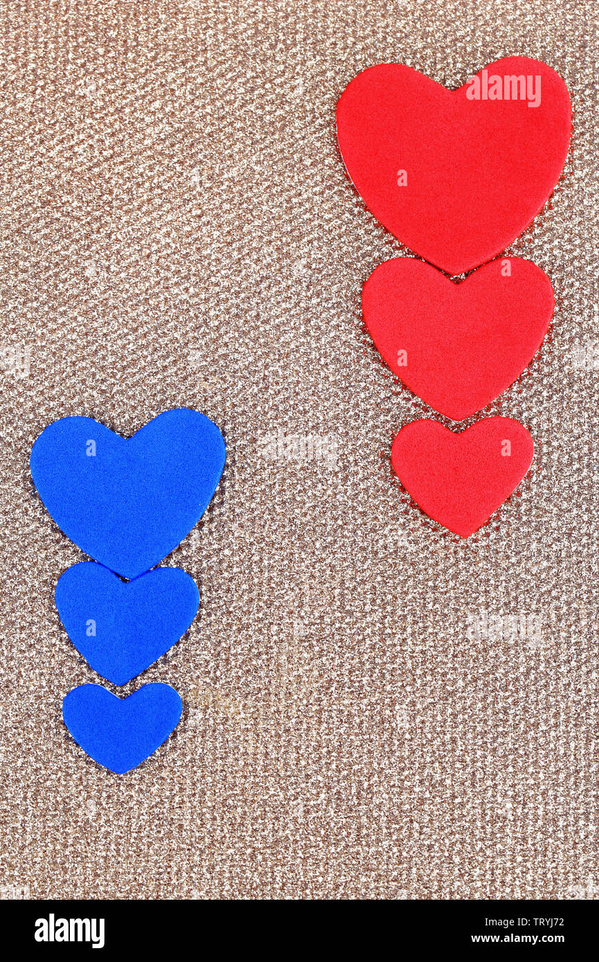 Hearts made of felt on golden background Stock Photo - Alamy