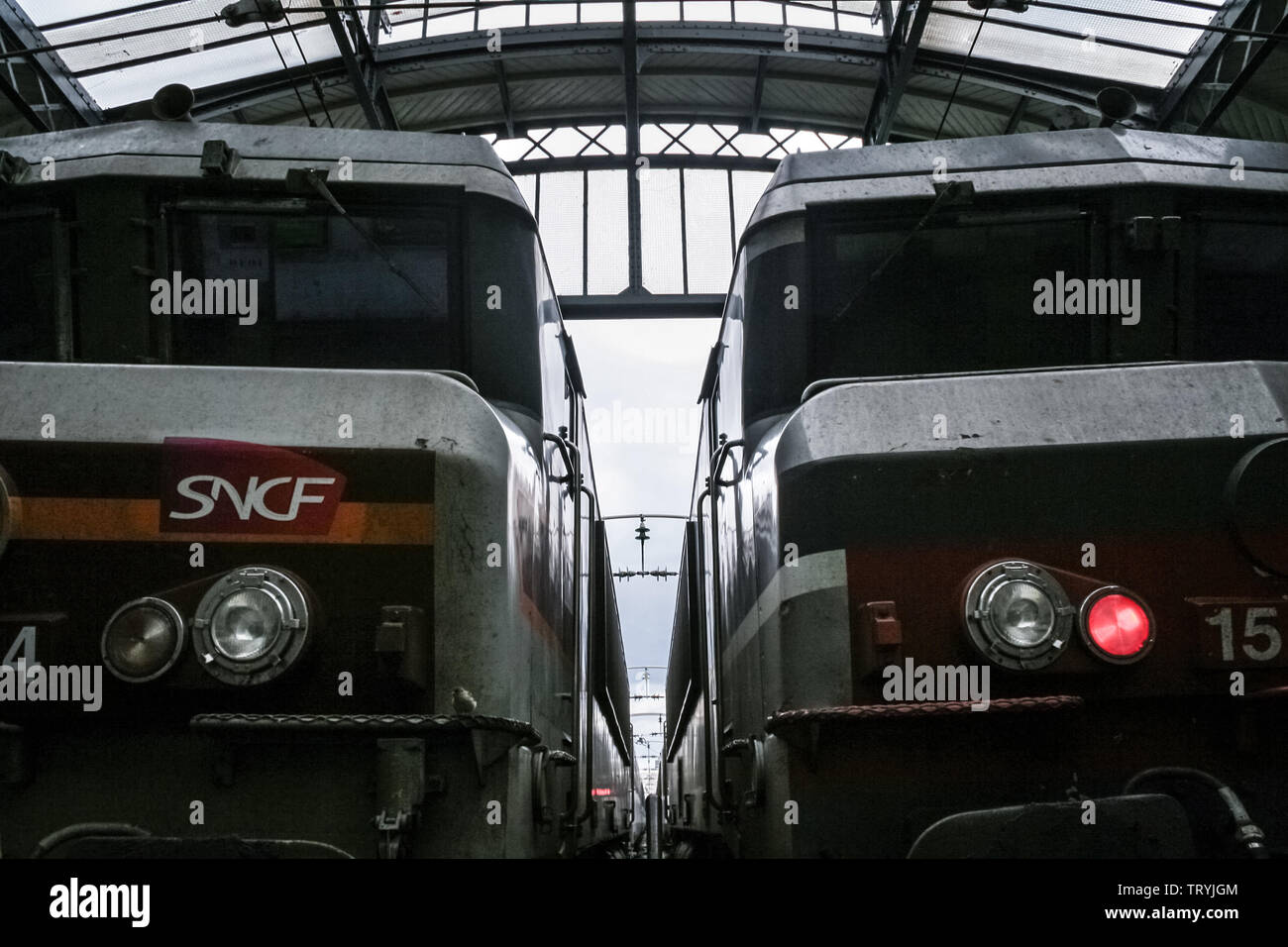 PARIS, FRANCE - AUGUST 19, 2006: Two trains ready for departure in Paris Gare de l'Est train station, with the logo of SNCF seen in front. This train Stock Photo