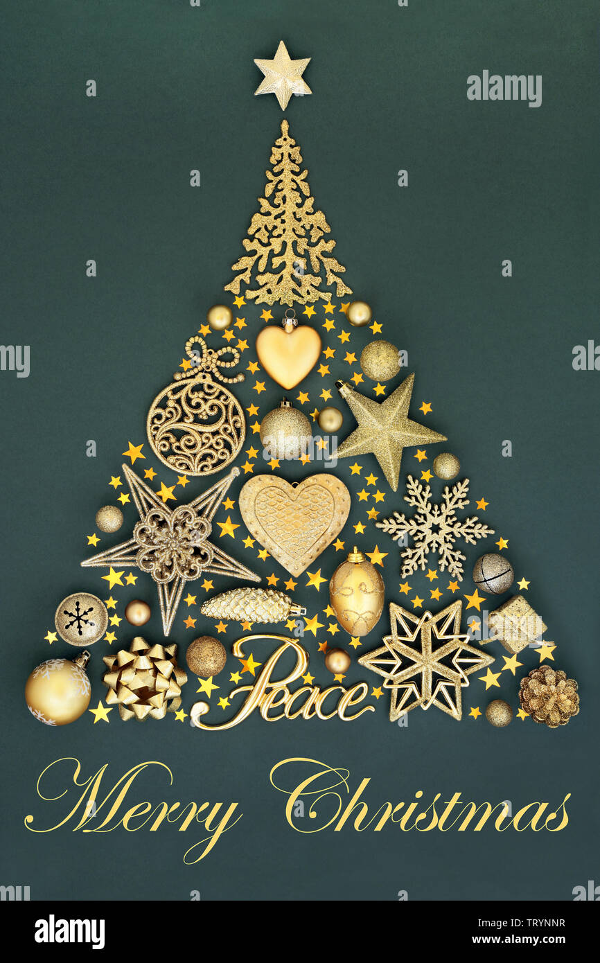 Abstract merry Christmas tree decoration with gold peace sign, baubles, ornaments and symbols on mottled green background. Traditional festive theme. Stock Photo