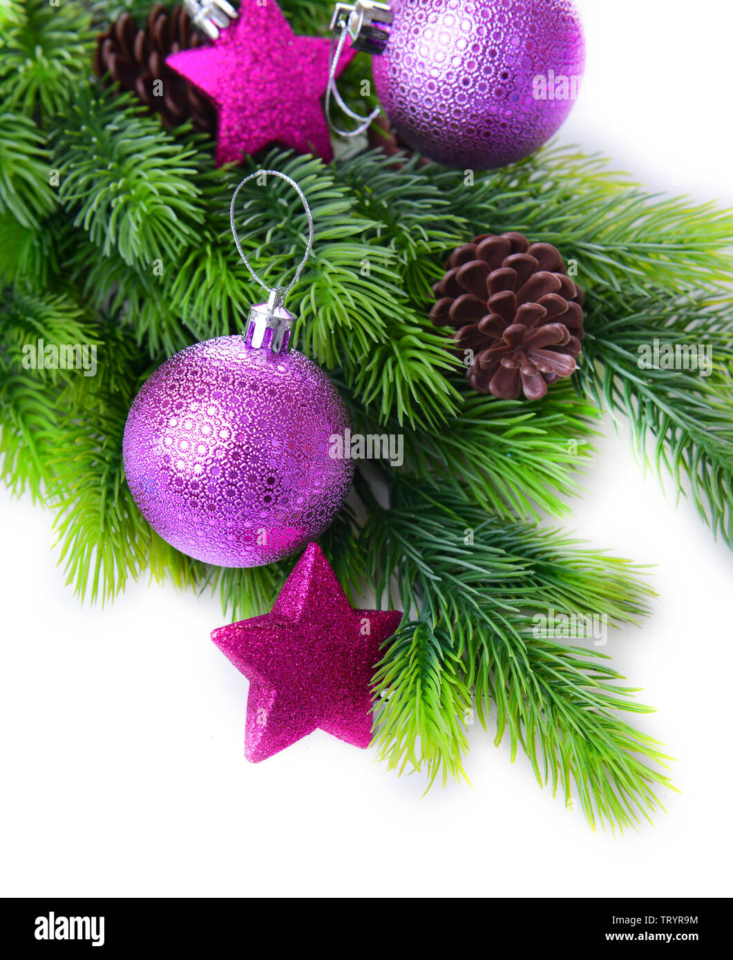 Christmas balls and decorative stars on fir tree, isolated on white ...