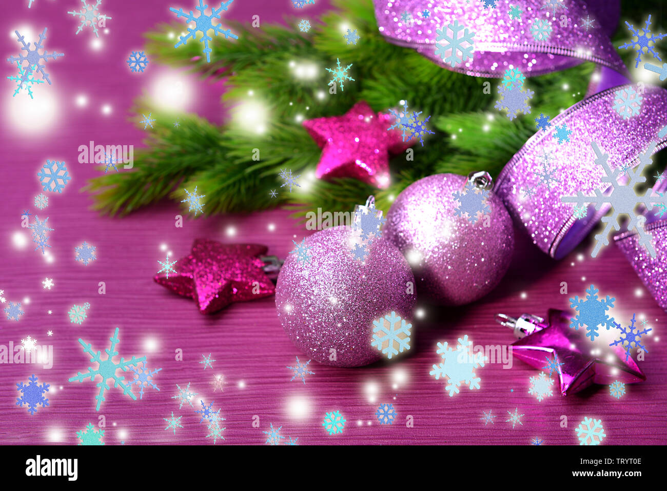 Christmas balls on fir tree, on color background Stock Photo - Alamy