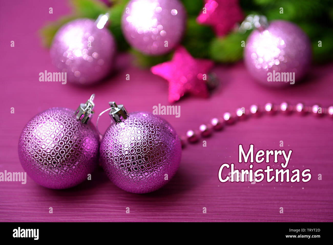 Christmas balls on fir tree, on color background Stock Photo - Alamy