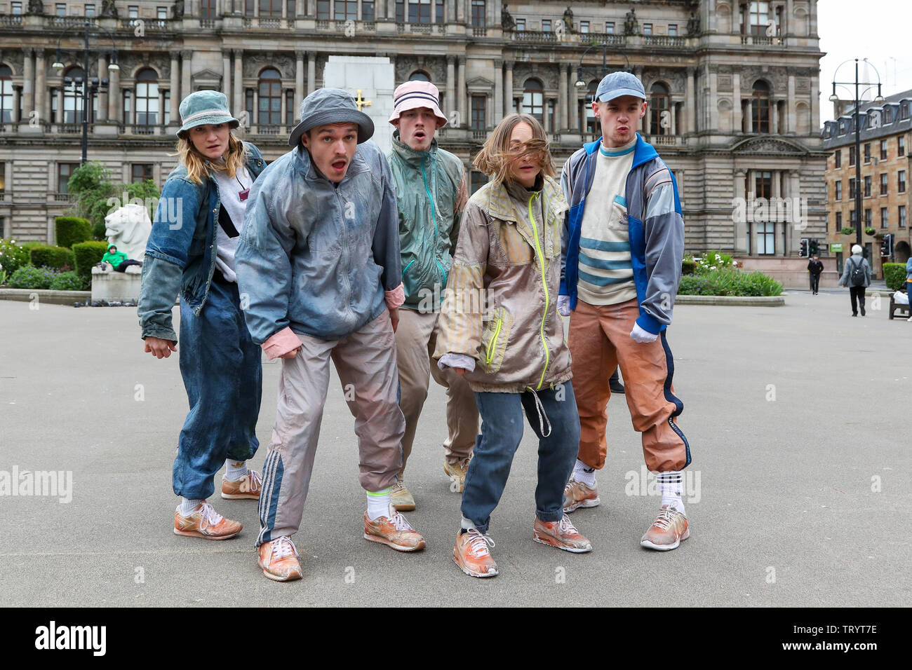 Glasgow, UK. 13 June 2019. Lunchtime crowds in Glasgow's George Square were treated to free dance show by the performers of 'WASTELAND' dance troupe, a high energy theatre marking the 25th anniversary of the demolition of Grimethorpe Colliery in South Yorkshire and 30 years since the rise of the UK rave culture. The Scottish premier is at Glasgow's Tramway theatre on 14th and 15th June. Credit: Findlay/Alamy Live News Stock Photo