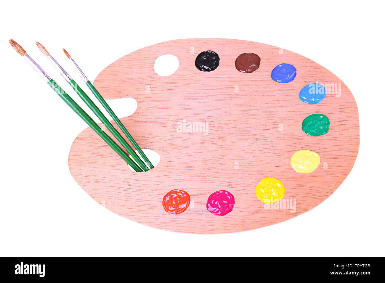 Wooden art palette with paint and brushes isolated on white Stock Photo ...