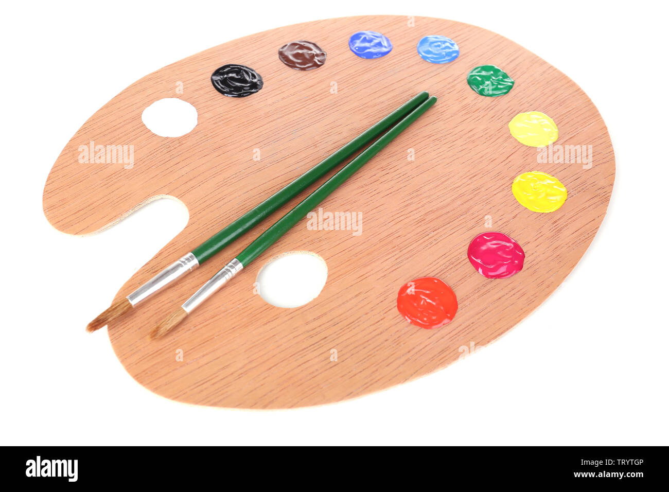 Wooden art palette with paint and brushes isolated on white Stock Photo ...