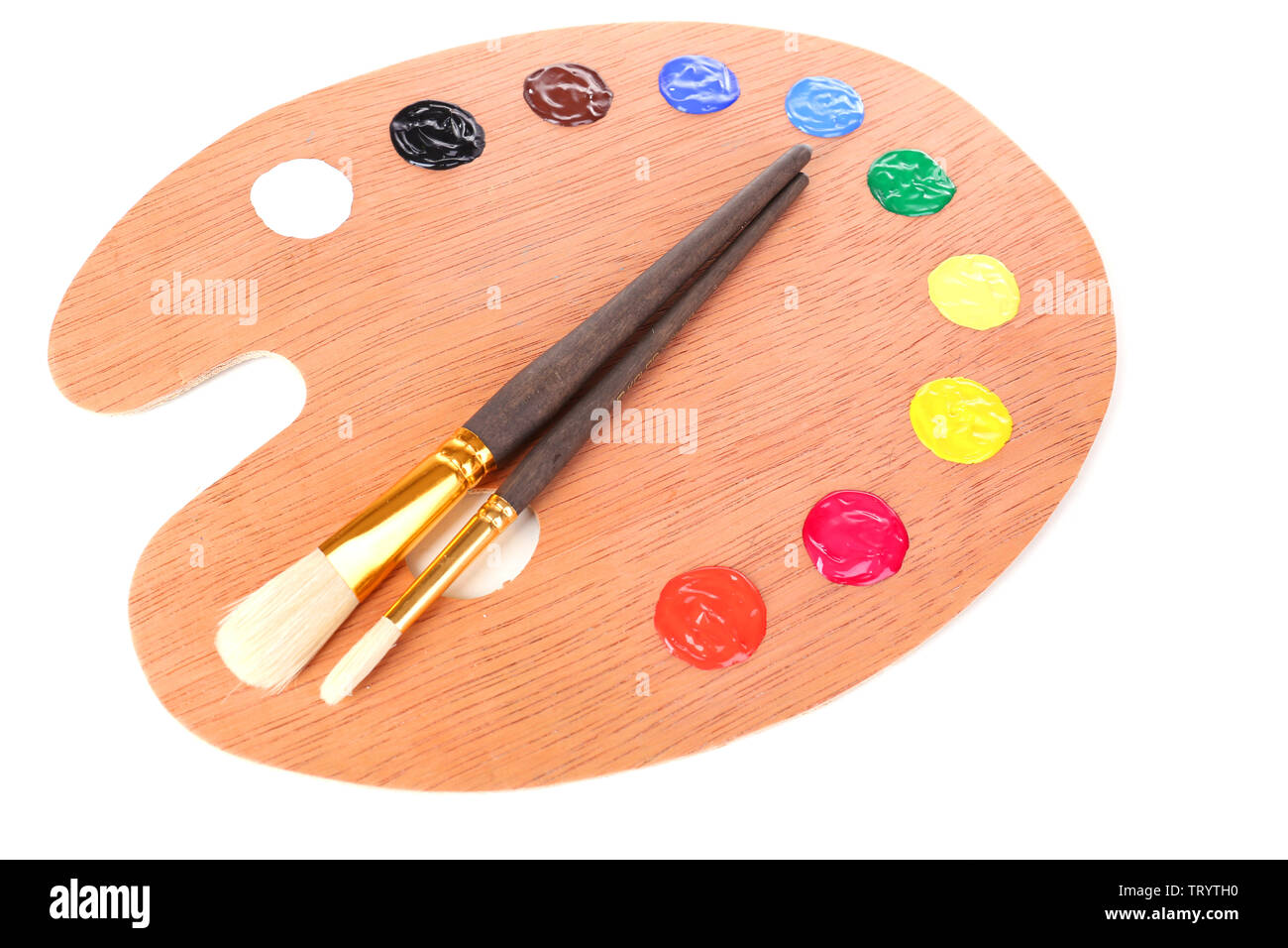 Wooden art palette with paint and brushes isolated on white Stock Photo ...
