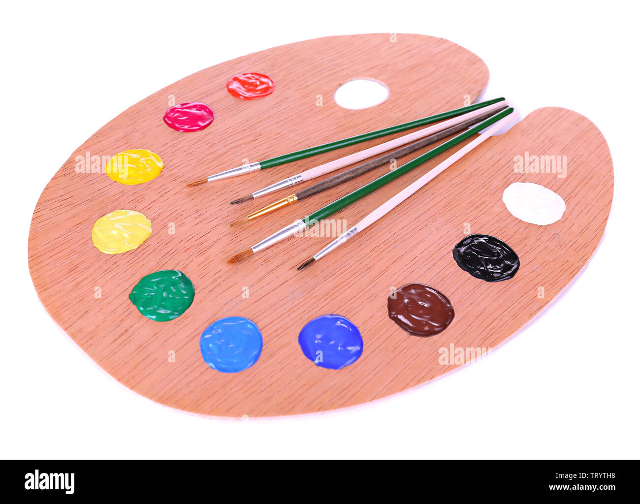 Wooden art palette with paint and brushes isolated on white Stock Photo ...
