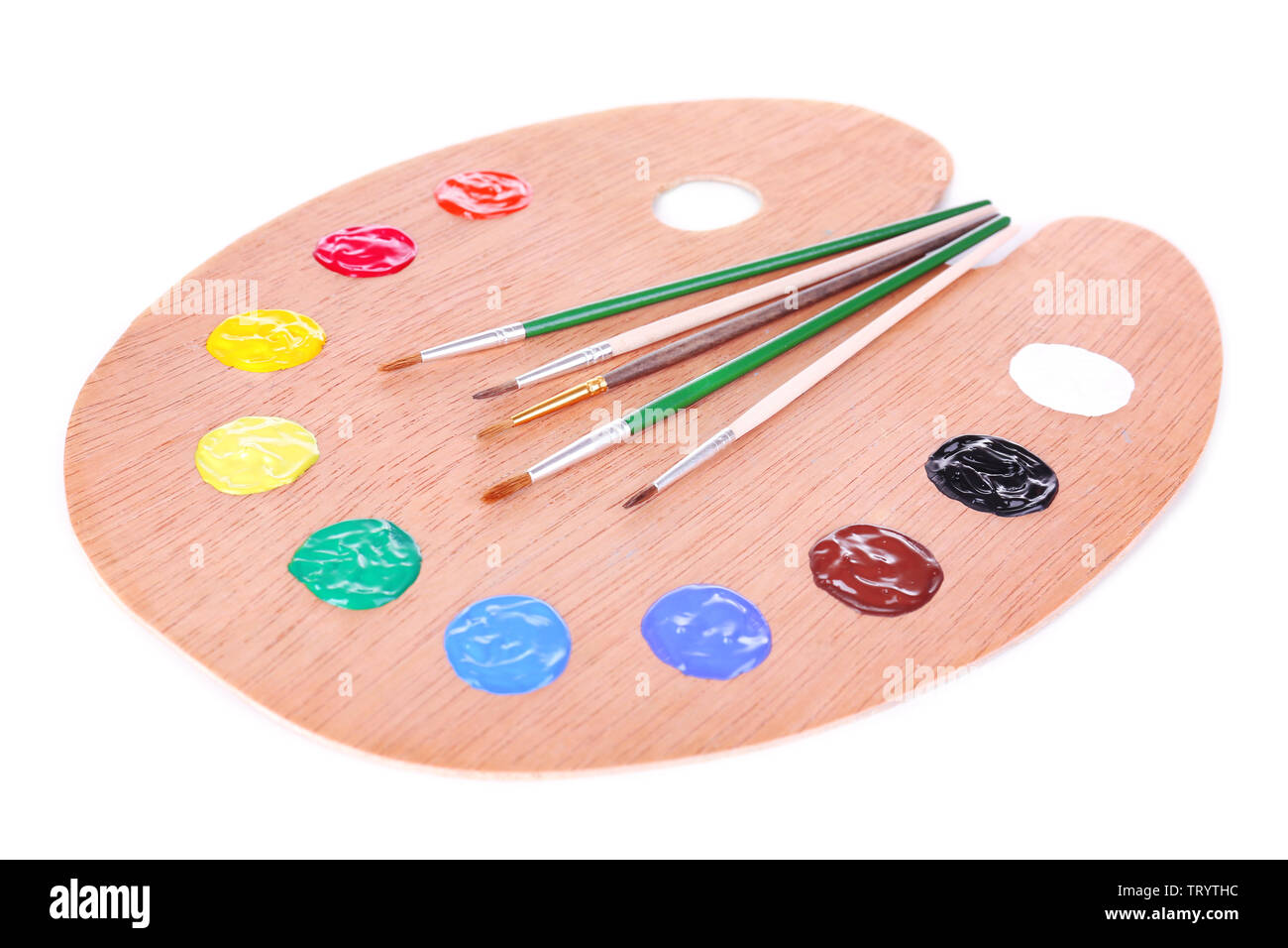 Wooden art palette with paint and brushes isolated on white Stock Photo ...