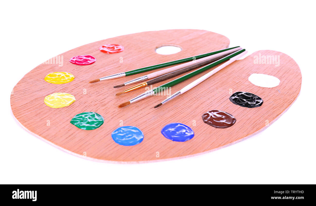 Wooden art palette with paint and brushes isolated on white Stock Photo ...