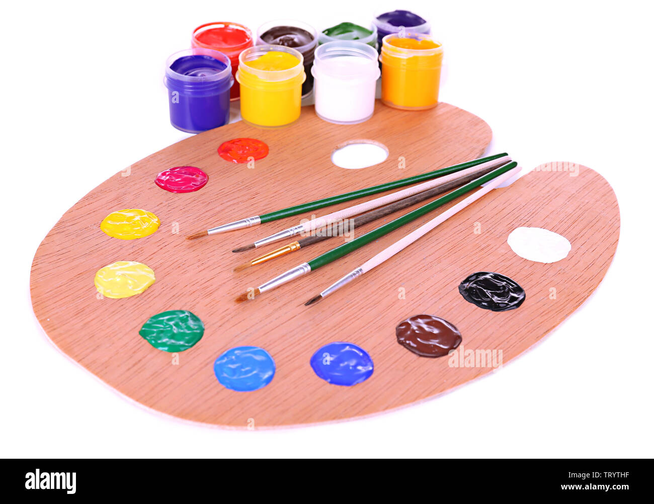 Wooden art palette with paint and brushes isolated on white Stock Photo ...