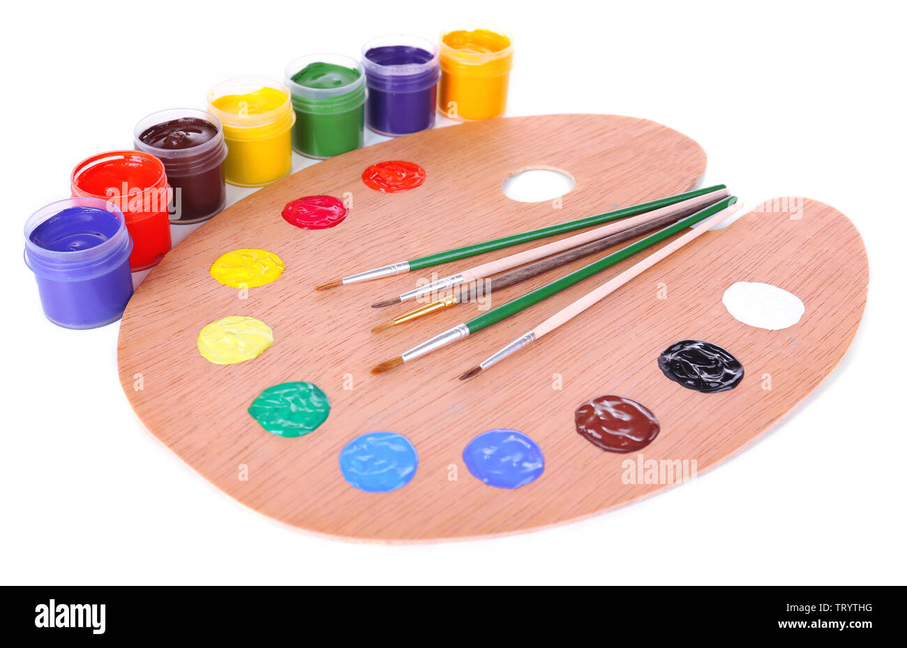 Wooden art palette with paint and brushes isolated on white Stock Photo ...