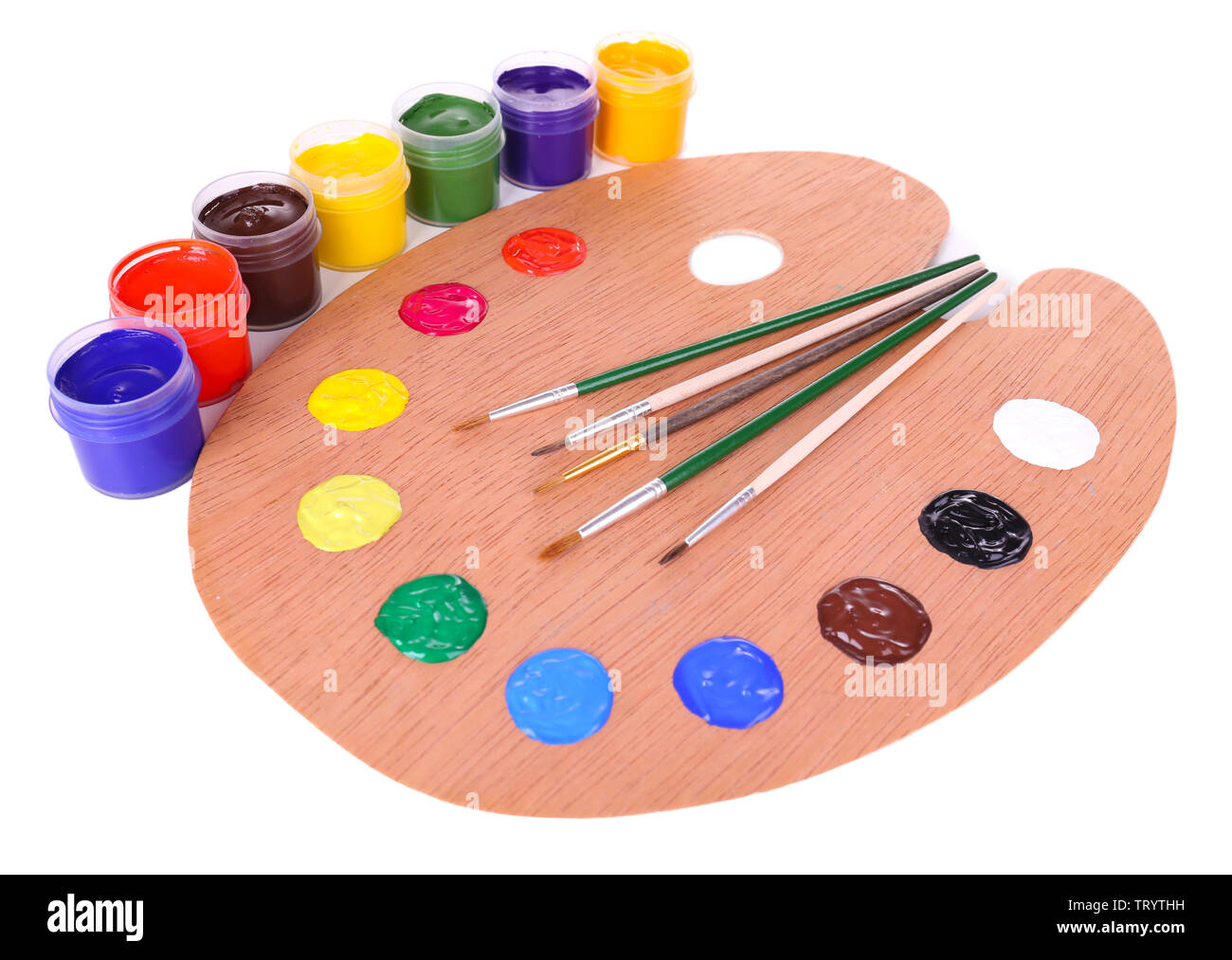 Wooden art palette with paint and brushes isolated on white Stock Photo ...