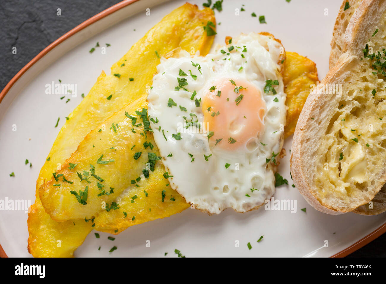 Smoked, farmed Basa fillets, Pangasius Hypophthalmus, imported from Vietnam and bought in the UK from a Lidl store. Basa, also known as river cobbler, Stock Photo