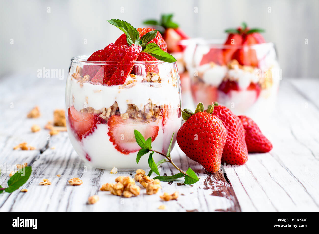 Healthy breakfast of strawberry parfaits made with fresh fruit, yogurt
